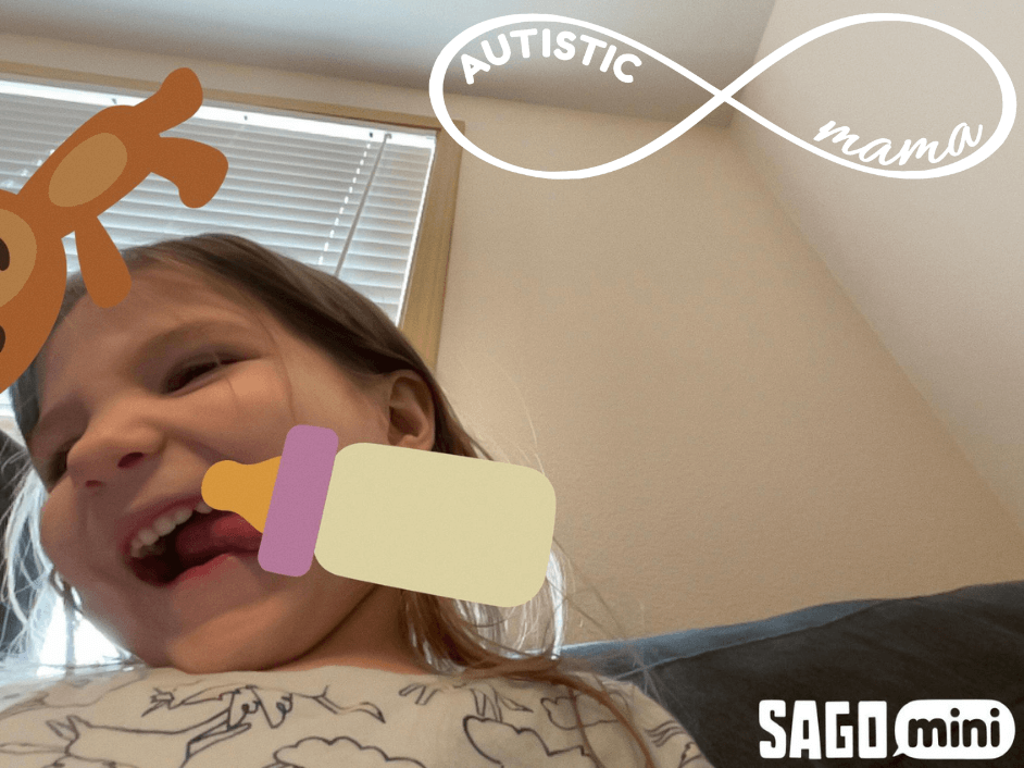 Selfie of a child with a bottle and baby toy filter from the SAGO Mini First Words App